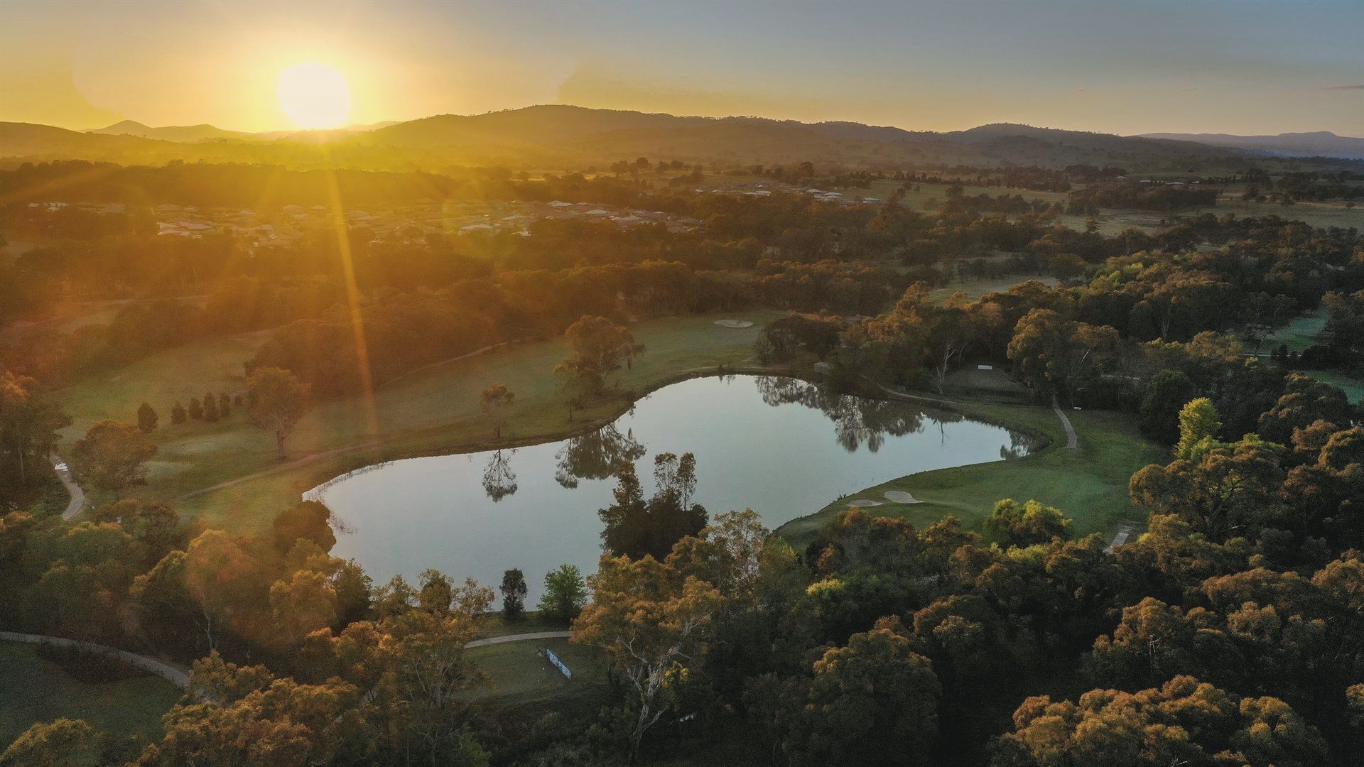 The lake and course at Thurgoona Country Club Resort at sunset, seen from above